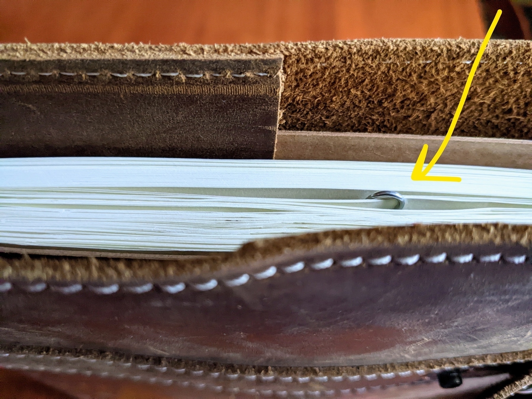 paper clip holding pages together in a large notebook